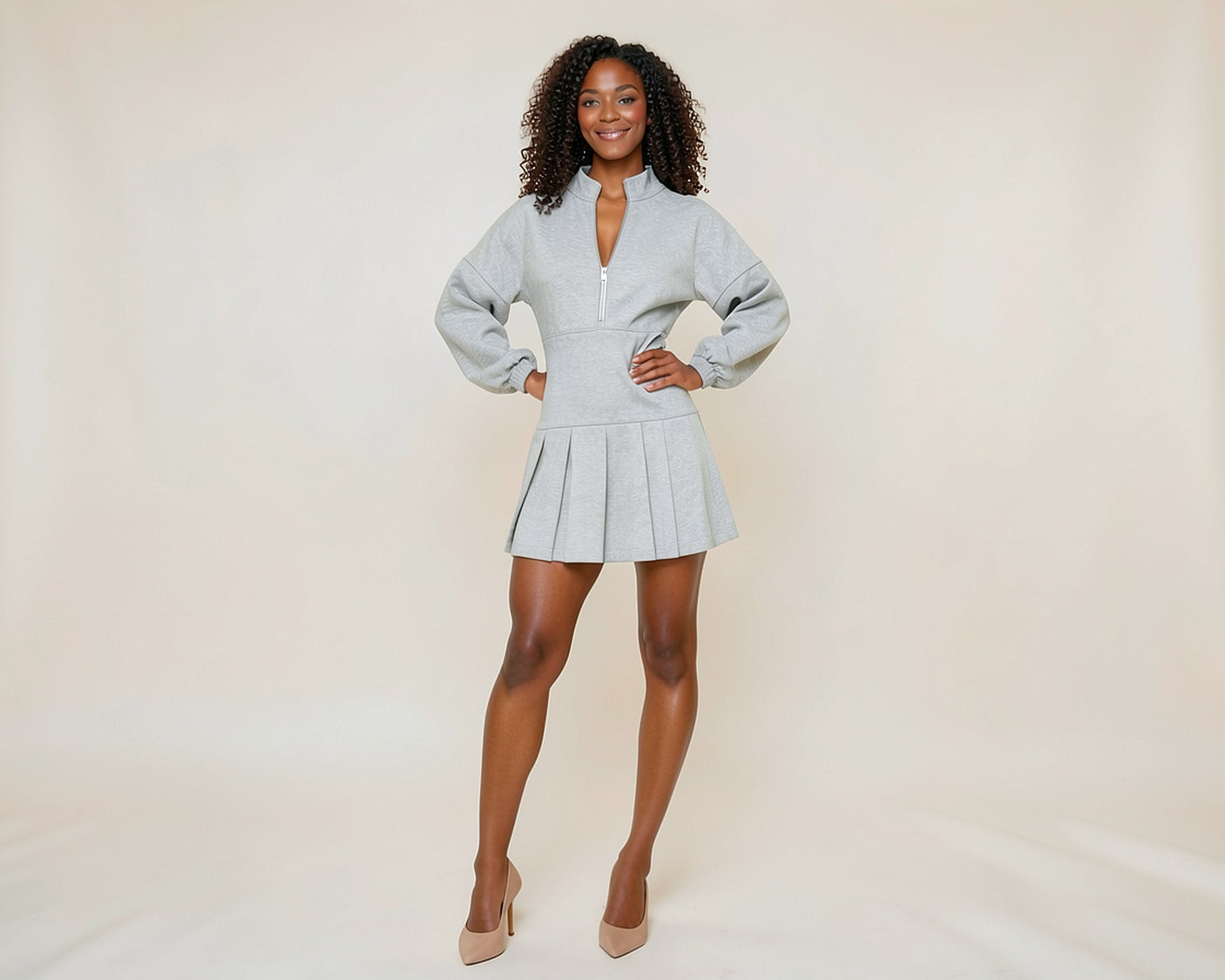 Woman wearing the Pleated Half-Zip Hoodie Dress